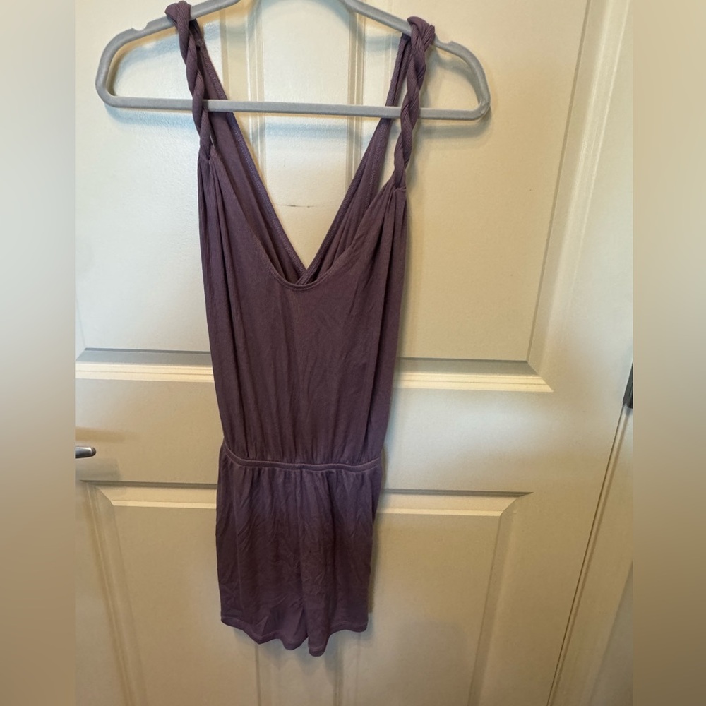 Brand new Becca romper size small purple color